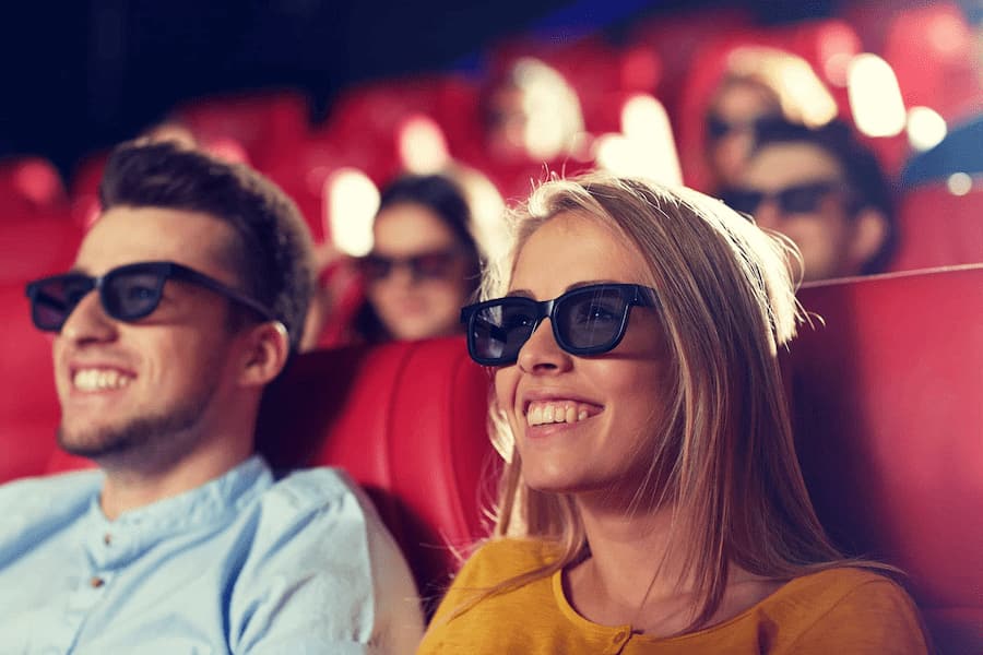2 people with 3D glasses in the cinema