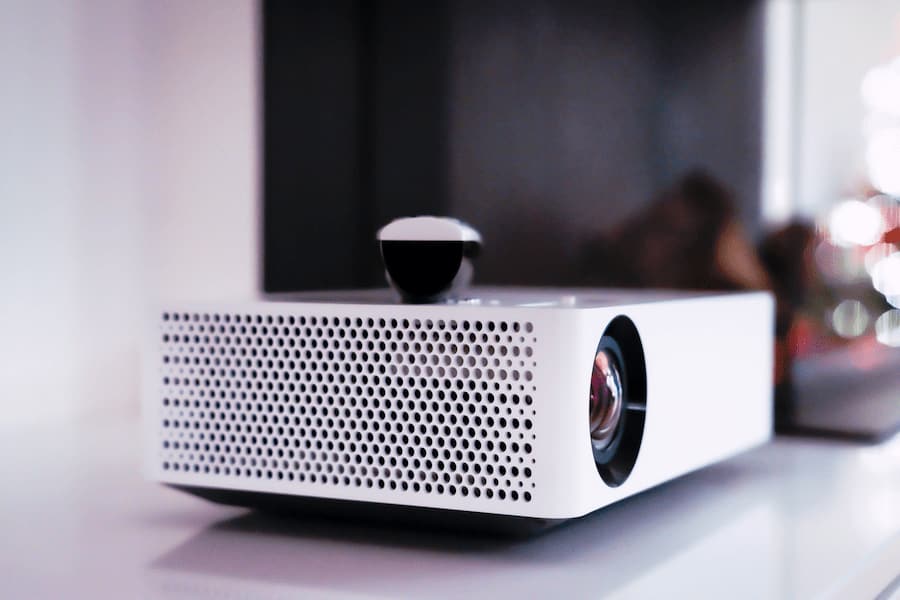 White projector with remote control