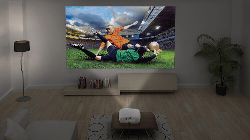Home cinema with beamer showing a football match